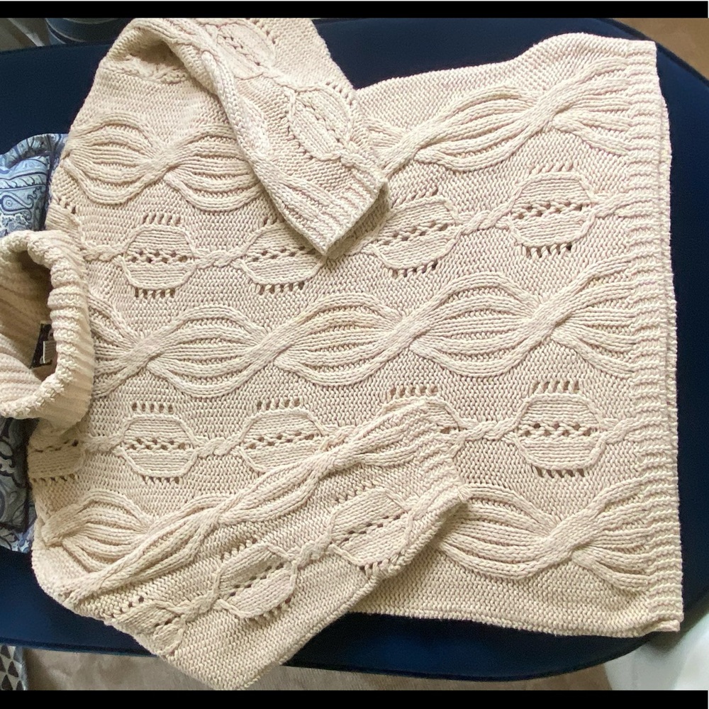 Cream colored cable knit sweater